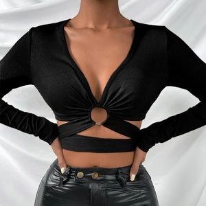 It’s a beautiful tie back knit tee with a beautiful ring on the middle